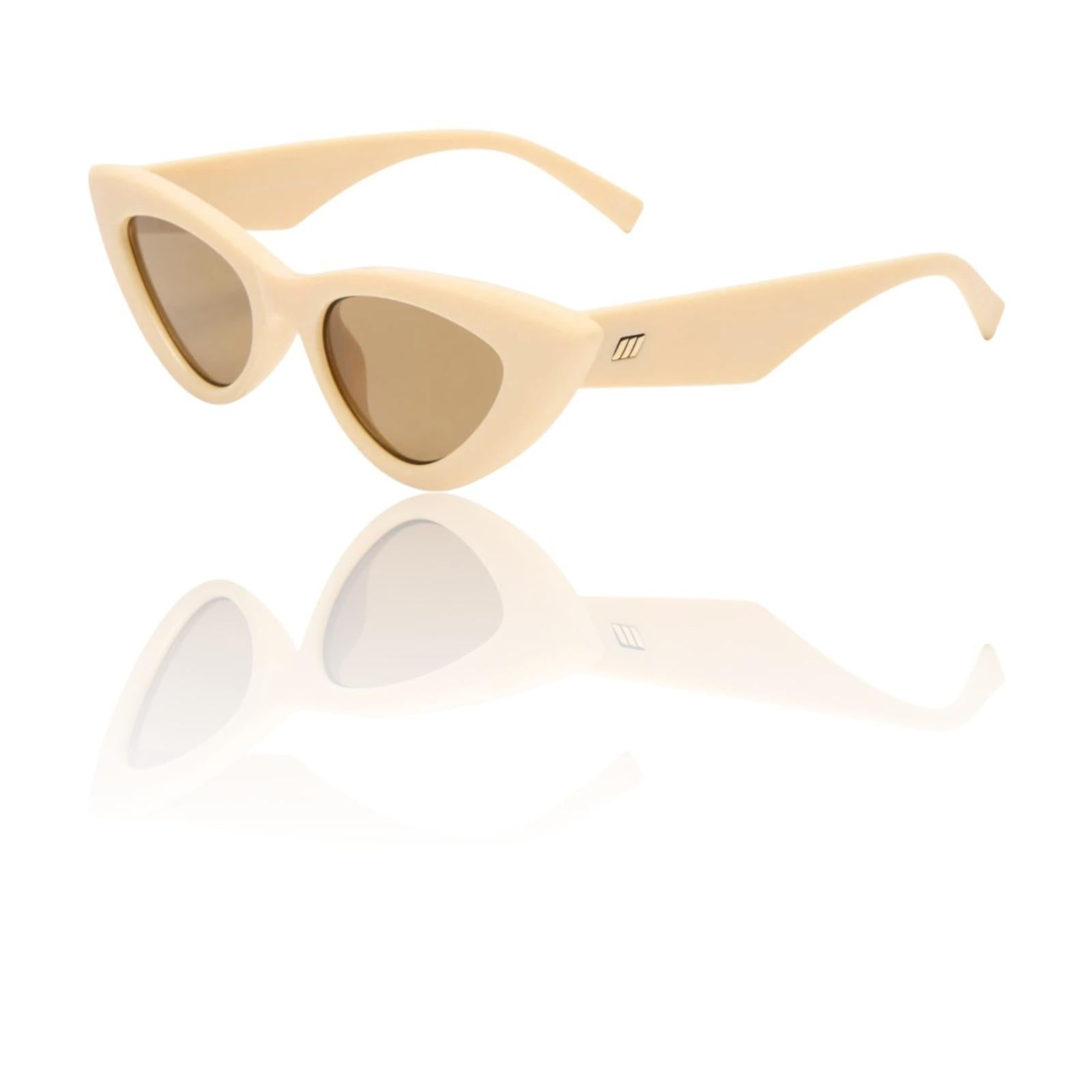 Beige cat-eye sunglasses with a reflective surface on a white background