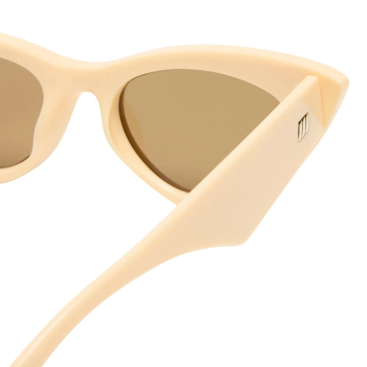 Beige cat-eye sunglasses with gold lenses on a white background