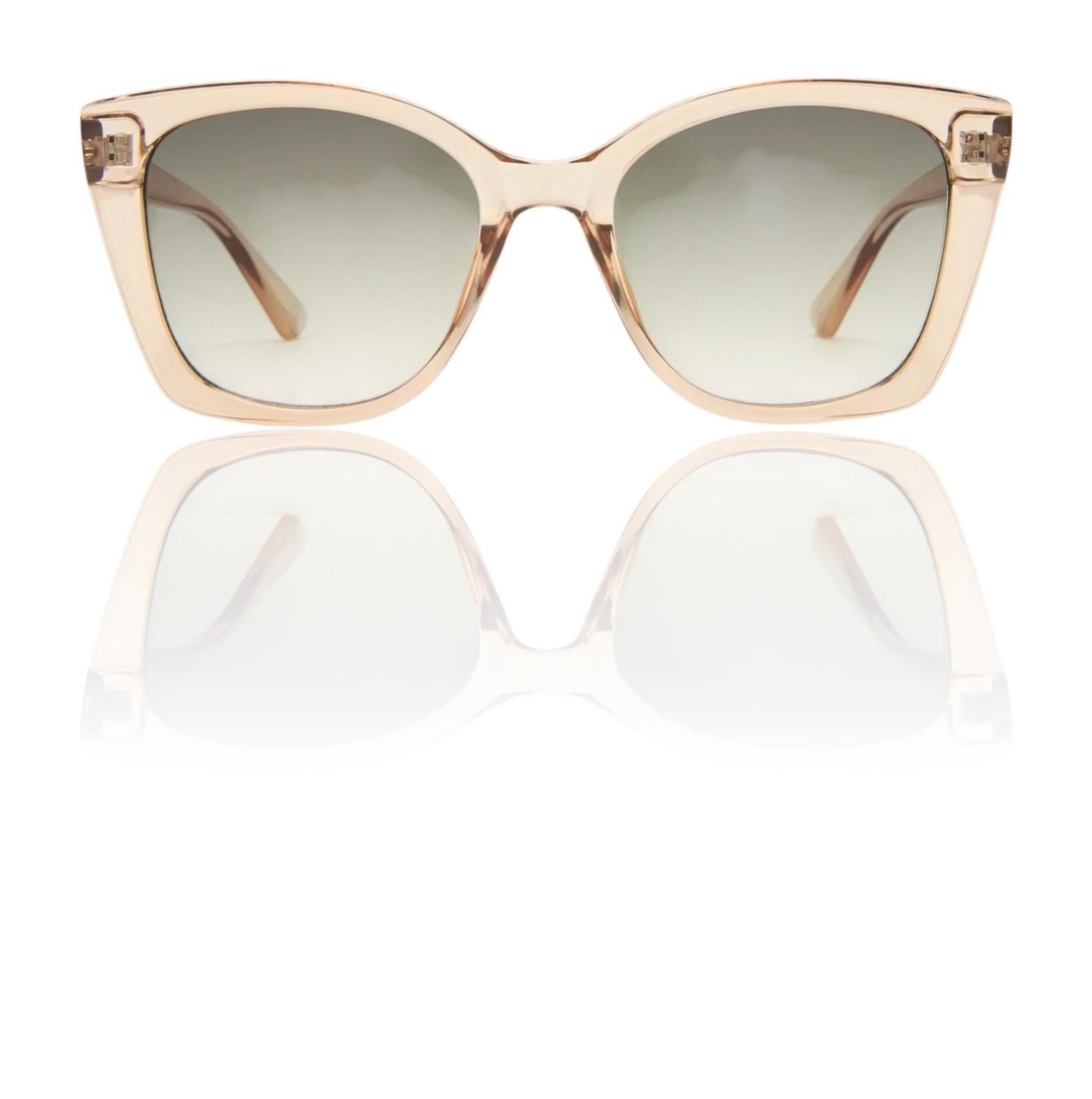 Beige sunglasses with a reflective surface on a white background