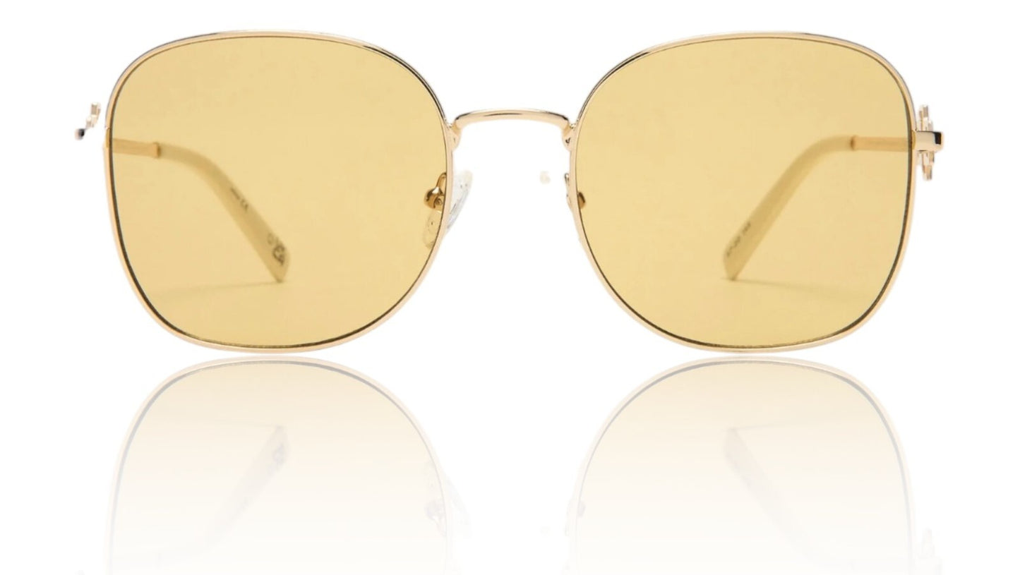 Gold sunglasses with yellow lenses on a white background
