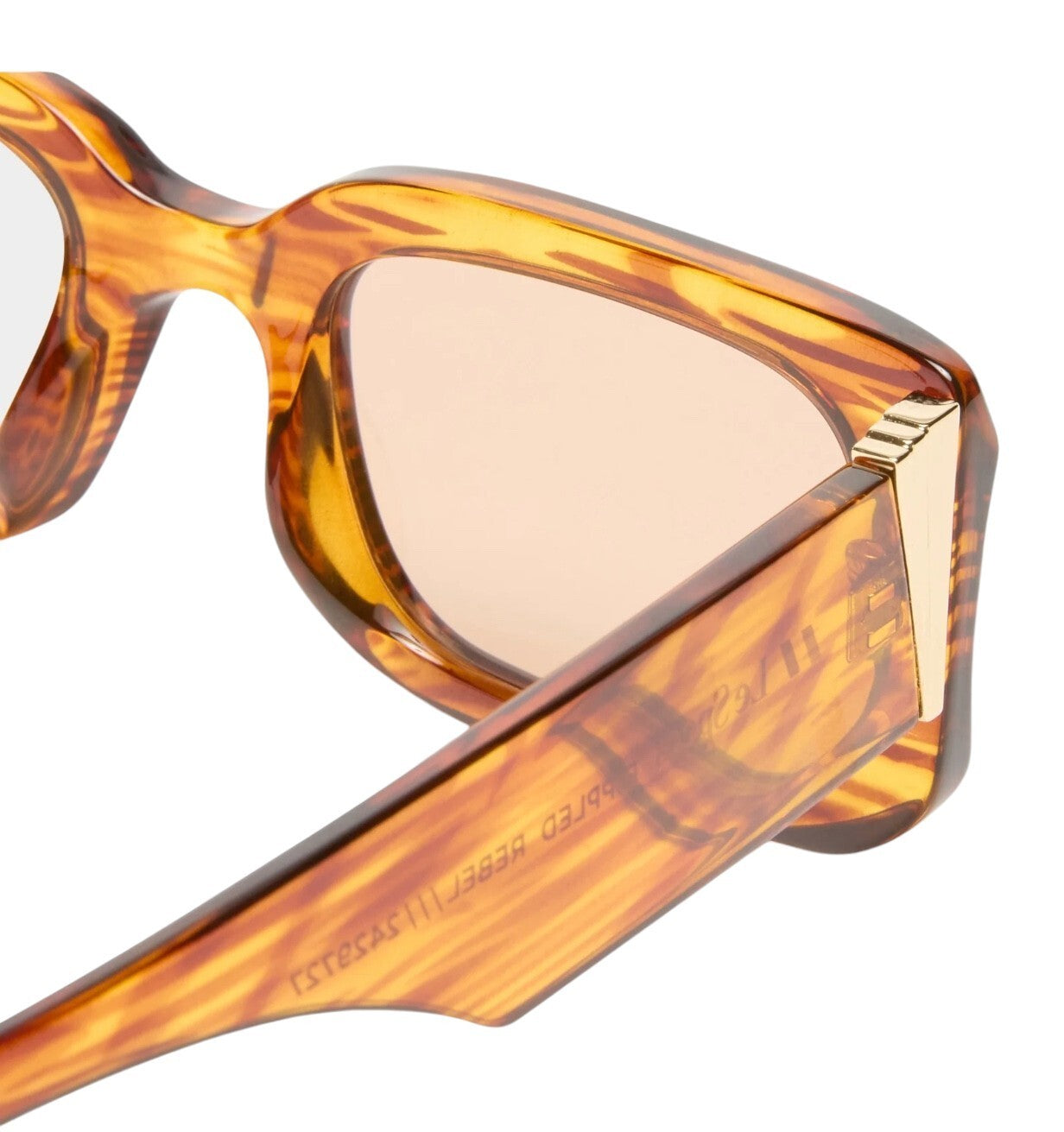 Tortoiseshell sunglasses with gold accents on a white background