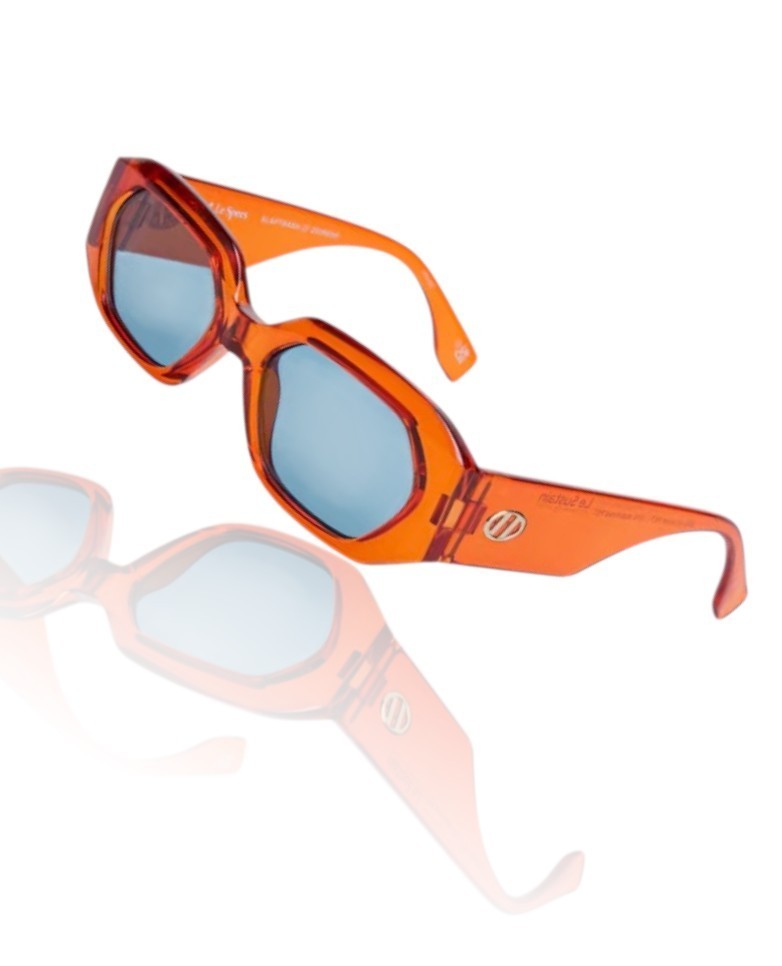 Two pairs of sunglasses, one orange and one pink, on a white background.