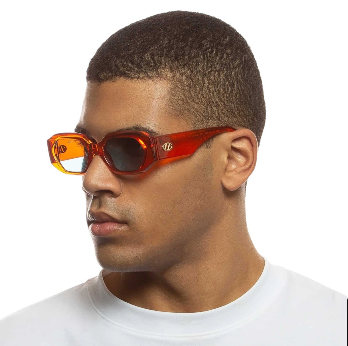 Man wearing red sunglasses with a white background