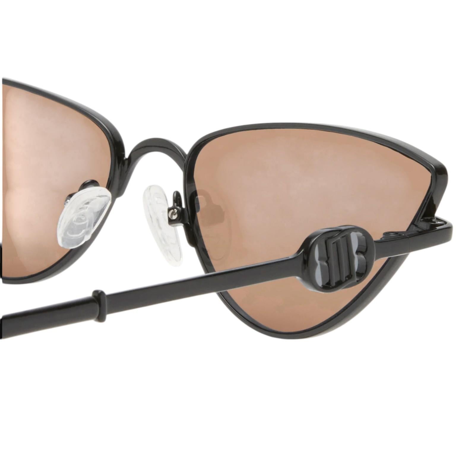 Sunglasses with black frame and brown lenses on a white background