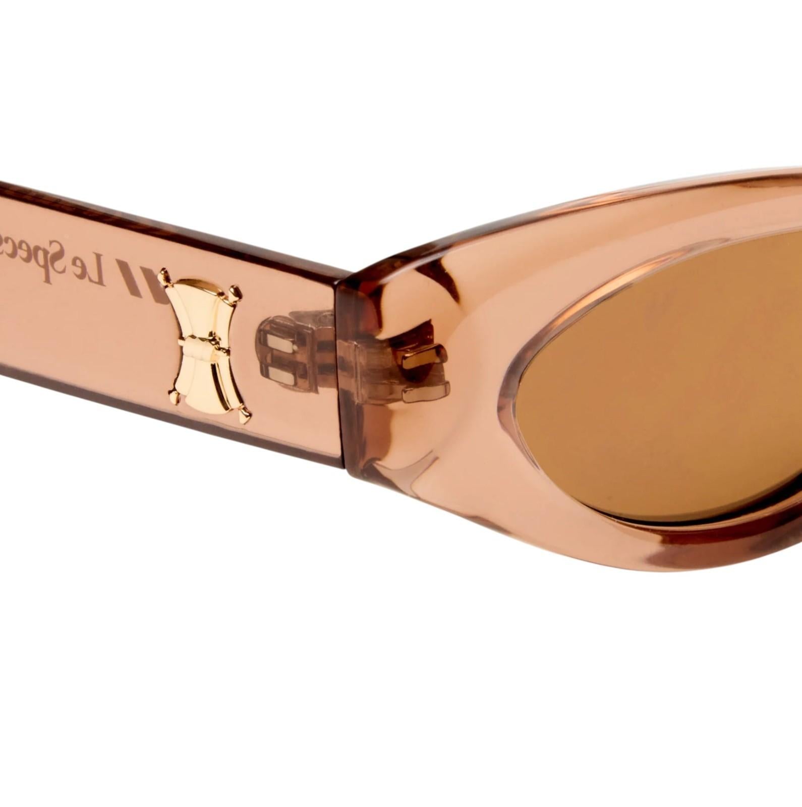 Close-up of a rose gold sunglasses with brand logo on a white background