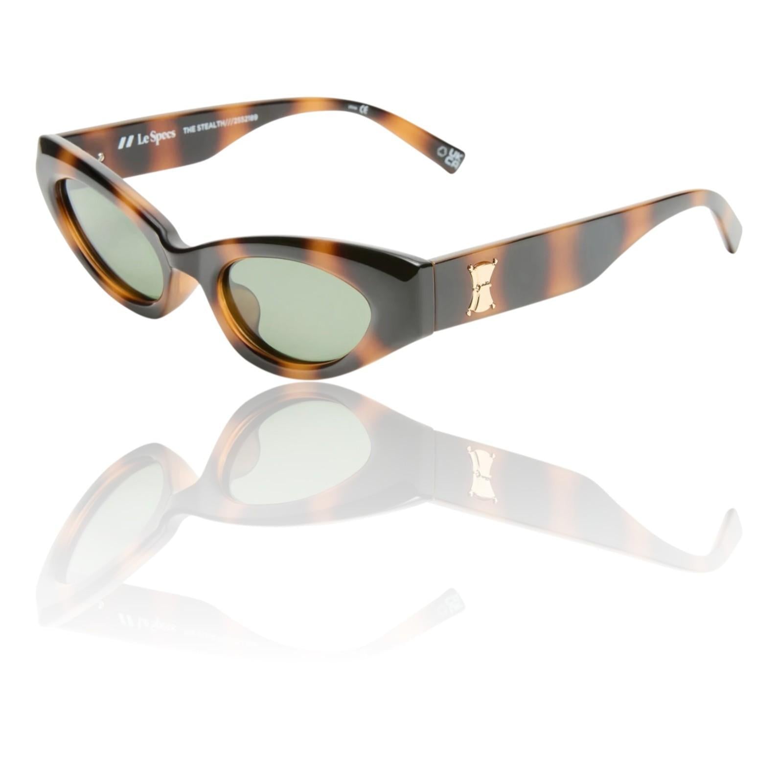 Sunglasses with tortoiseshell frame and reflective surface on a white background