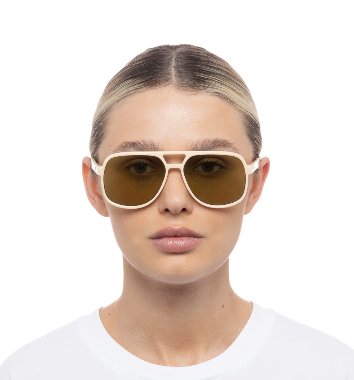 Person wearing a pair of sunglasses with a white background