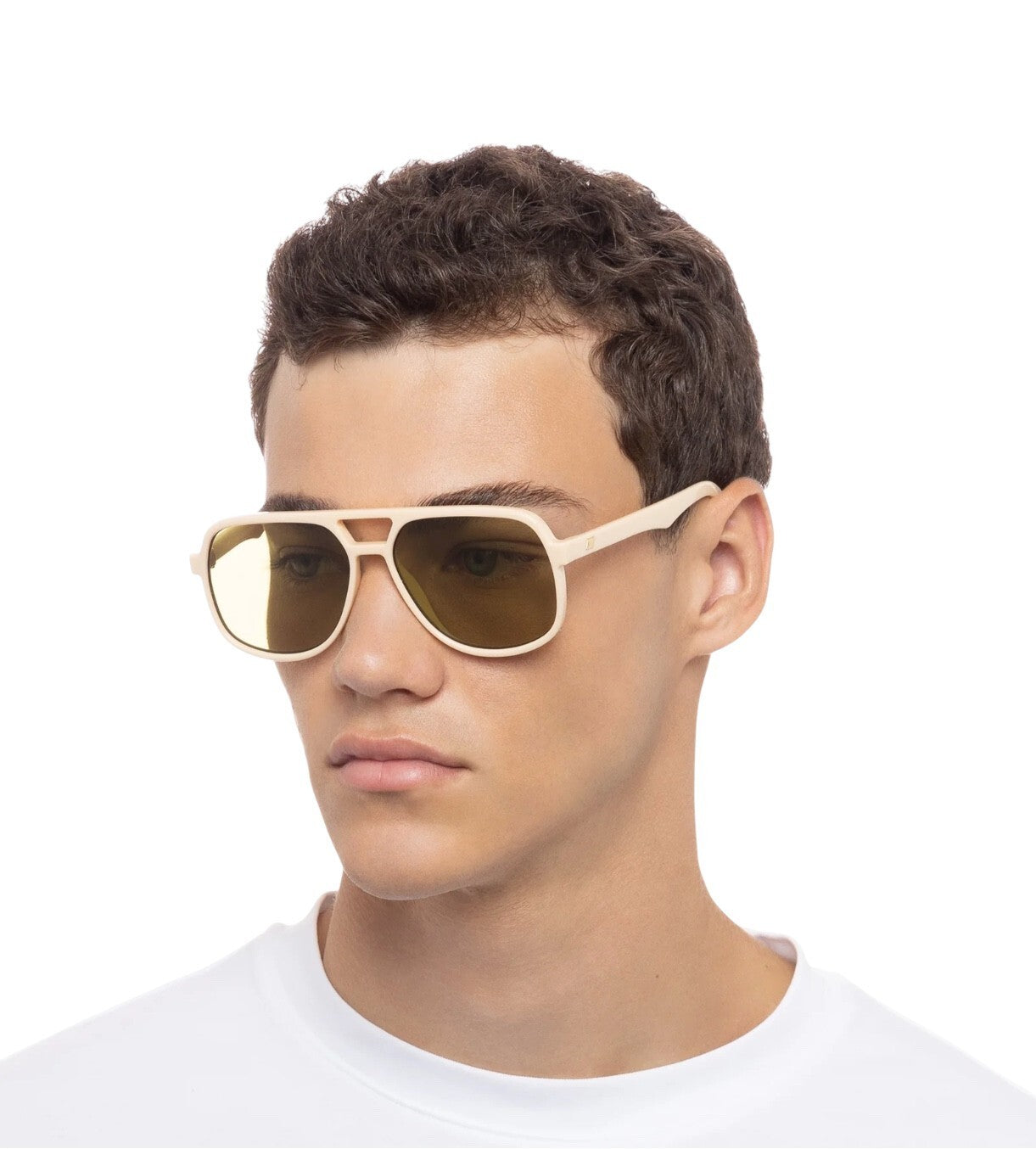 Man wearing beige sunglasses with a white background