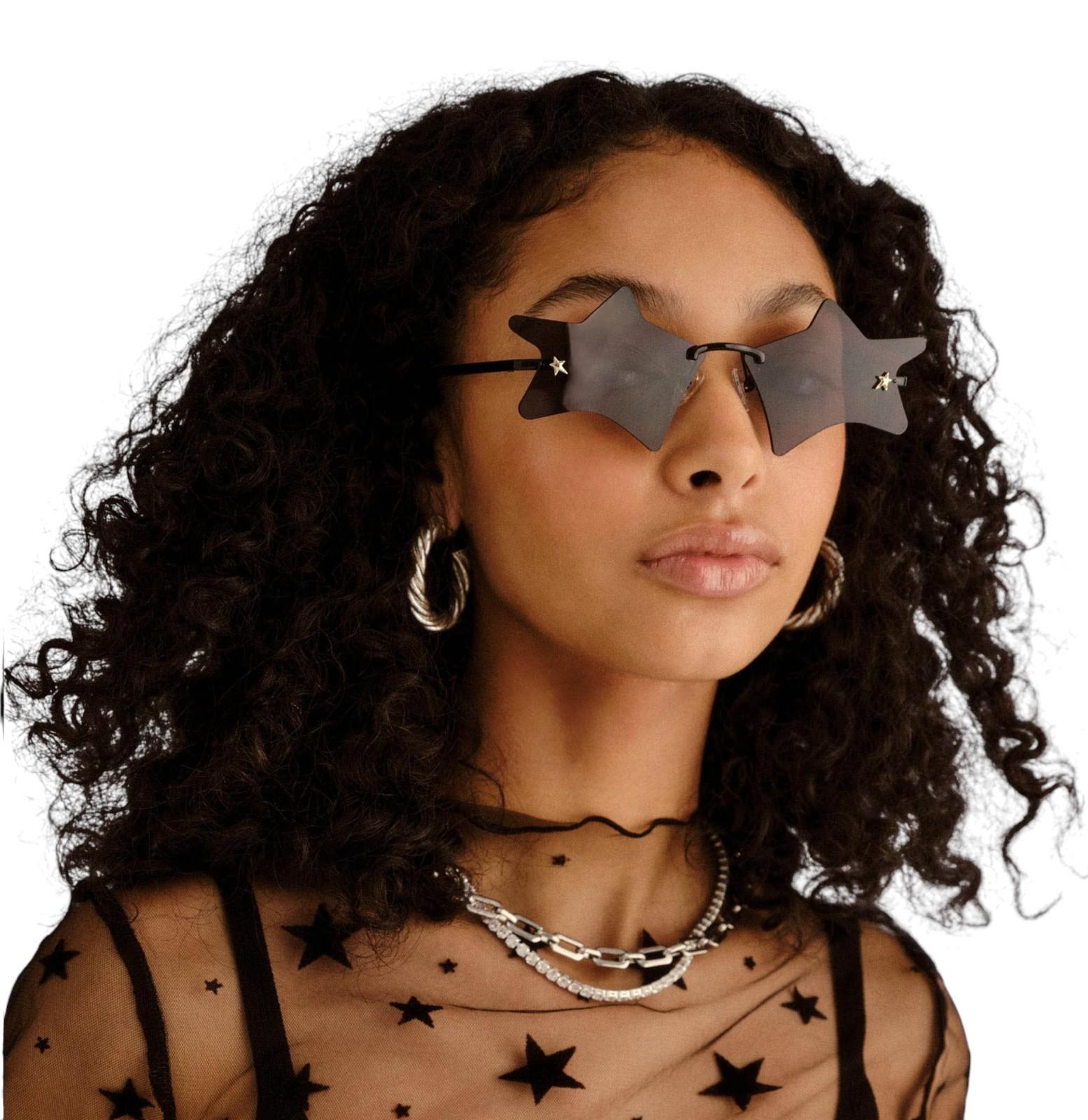 Woman wearing star-shaped sunglasses with a plain background