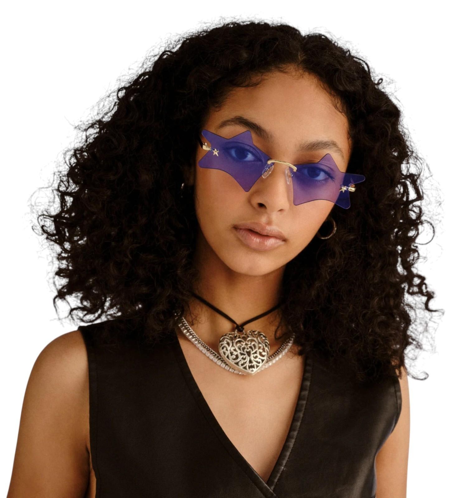 Person wearing purple sunglasses with a white background