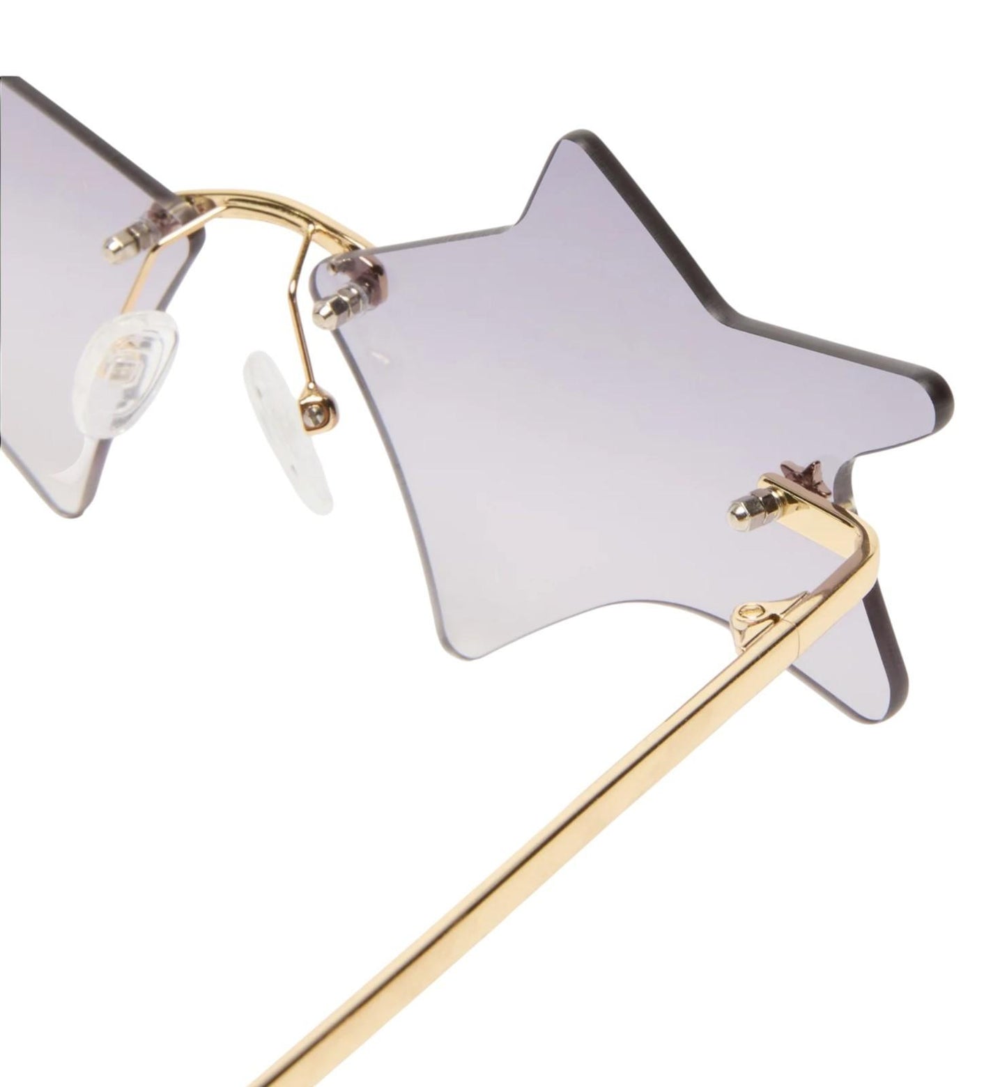 Star-shaped sunglasses with gold frame on a white background