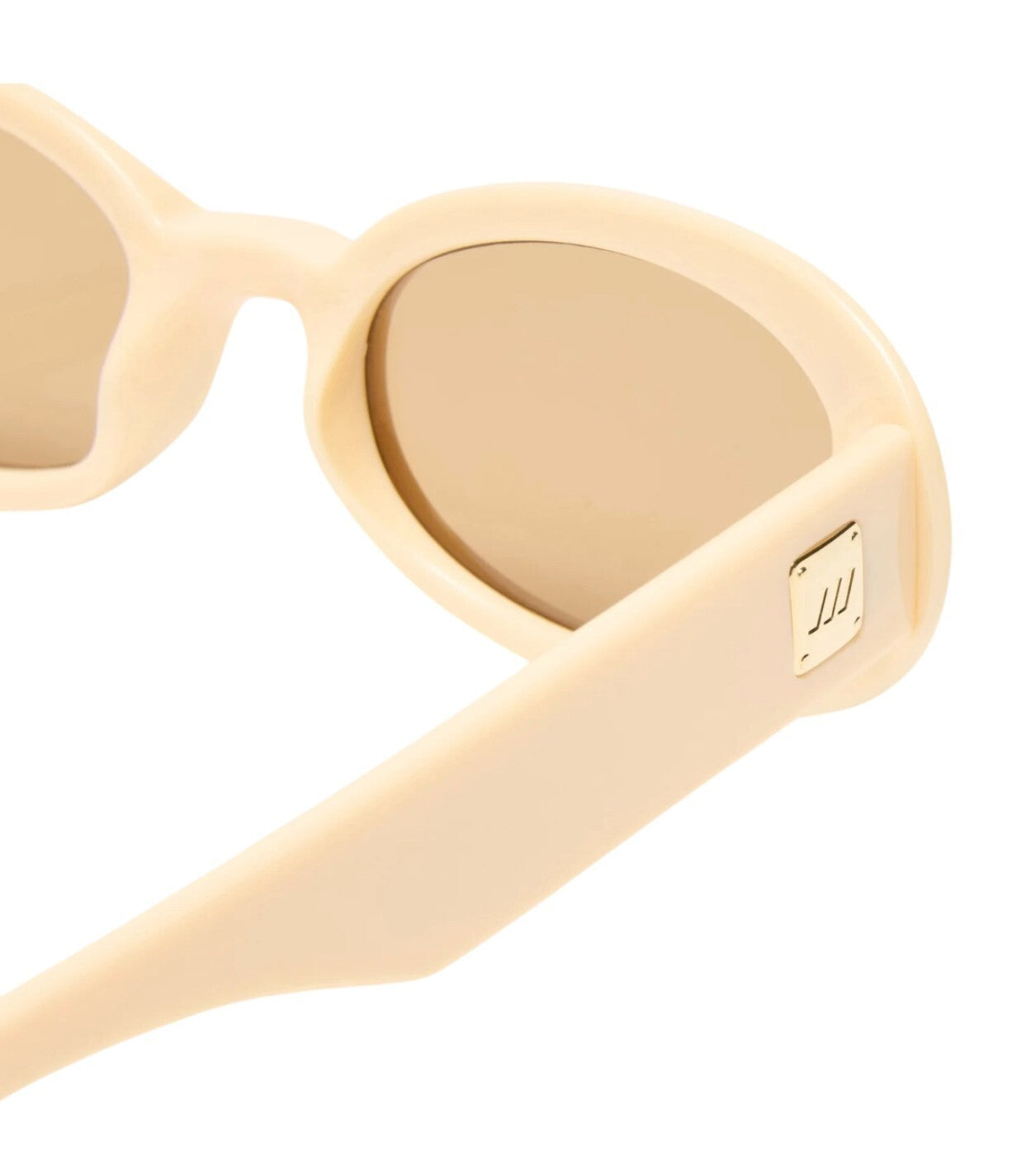 Beige heart-shaped sunglasses with a brand logo on a white background