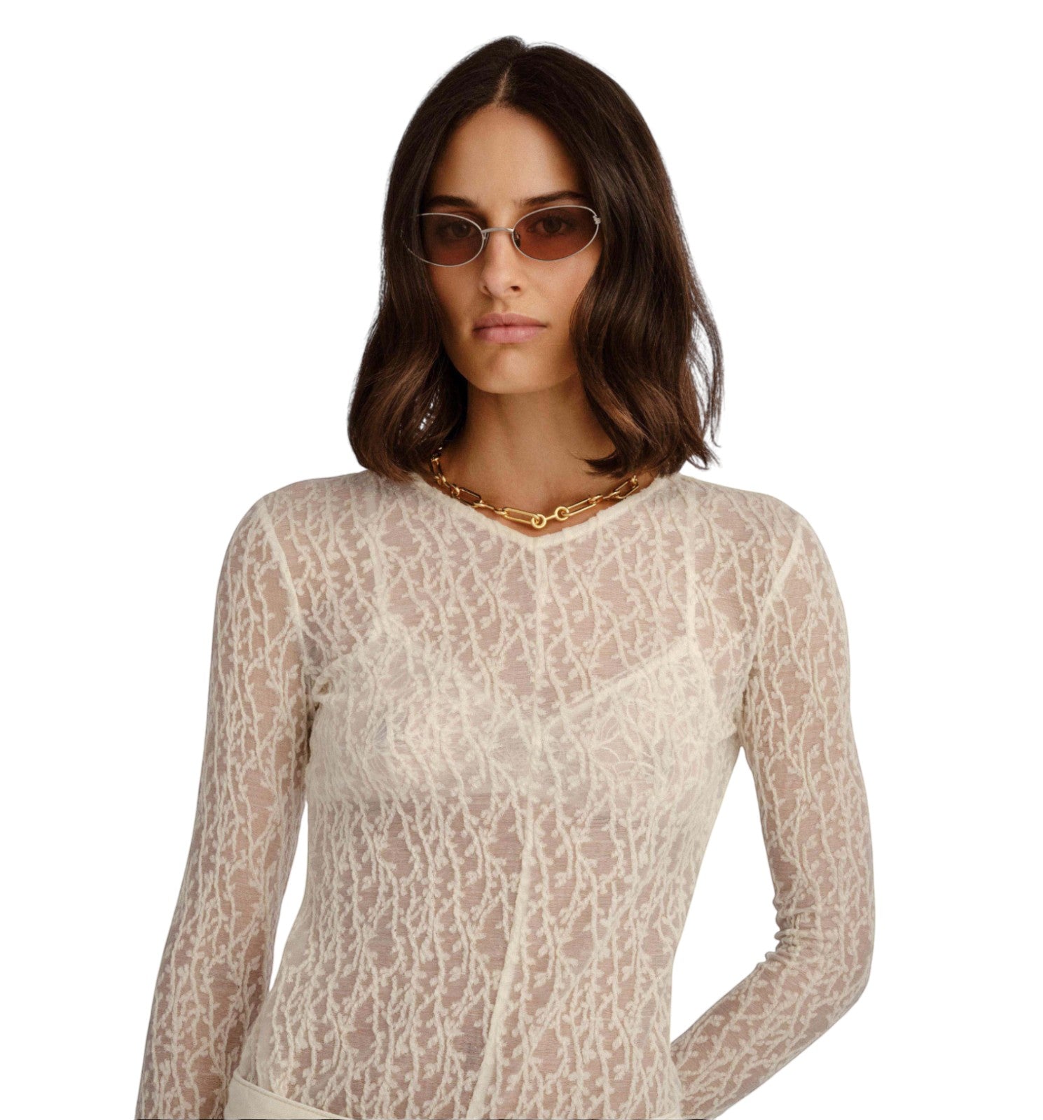 Model wearing Naked Pear Luv Lou The Rose cat-eye sunglasses with brushed silver frames and tan mono lenses.