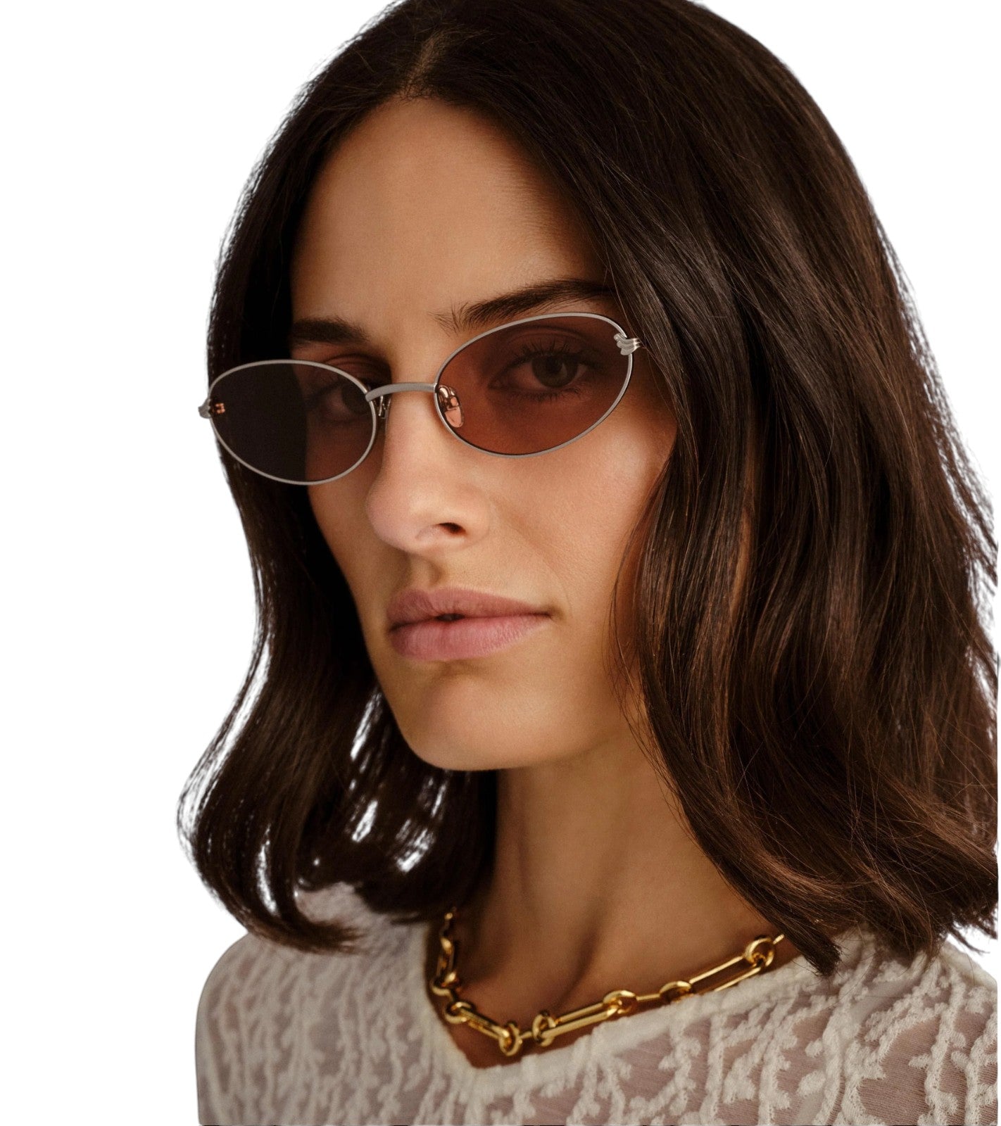 Naked Pear Luv Lou The Rose cat-eye sunglasses with brushed silver metal frames and tan mono lenses on a woman