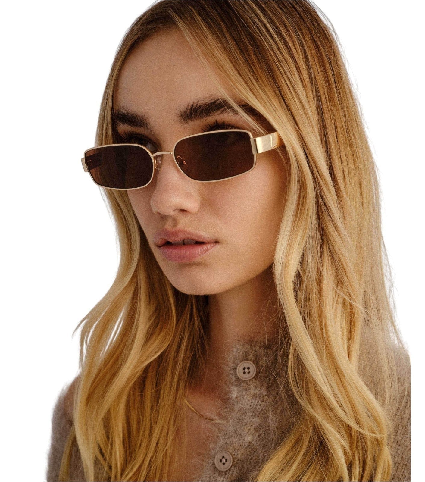 Naked Pear Luv Lou The Ryan rectangular gold metal sunglasses with brown polarised lenses worn by a blonde woman