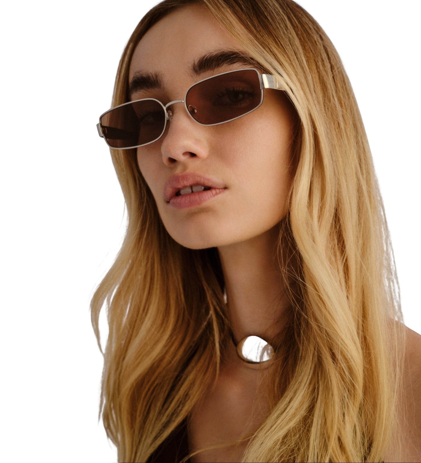 Naked Pear Luv Lou The Ryan rectangular silver metal sunglasses with khaki green lenses worn by a blonde woman