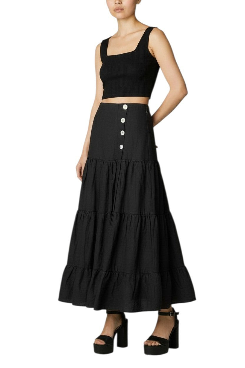 AI generated image of Woman wearing a black tiered skirt with a black top on a white background