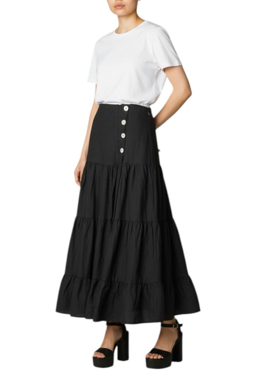 AI generated image of Person wearing a black tiered skirt with white buttons and a white top on a white background