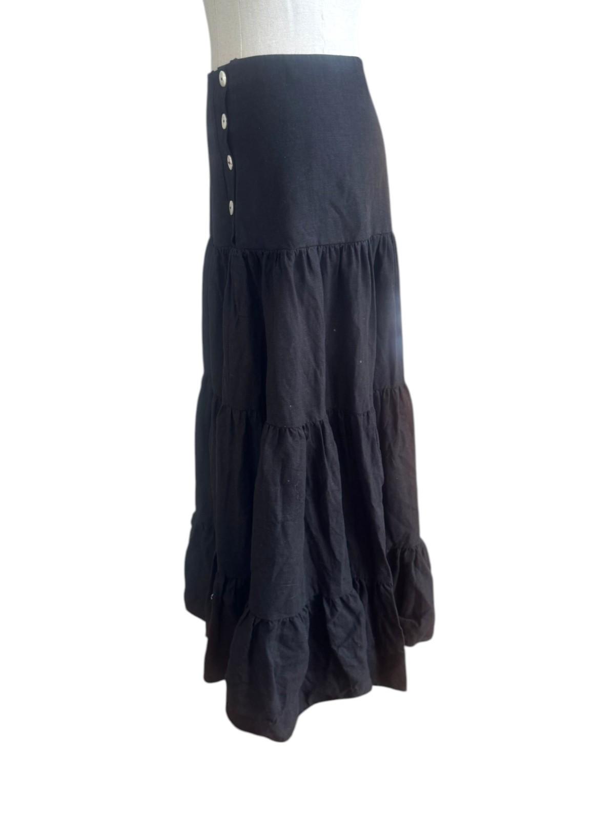 Black skirt with buttons on a white background