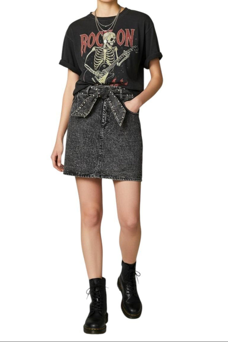 AI generated image of Person wearing a graphic t-shirt with a skeleton design and a denim skirt on a white background