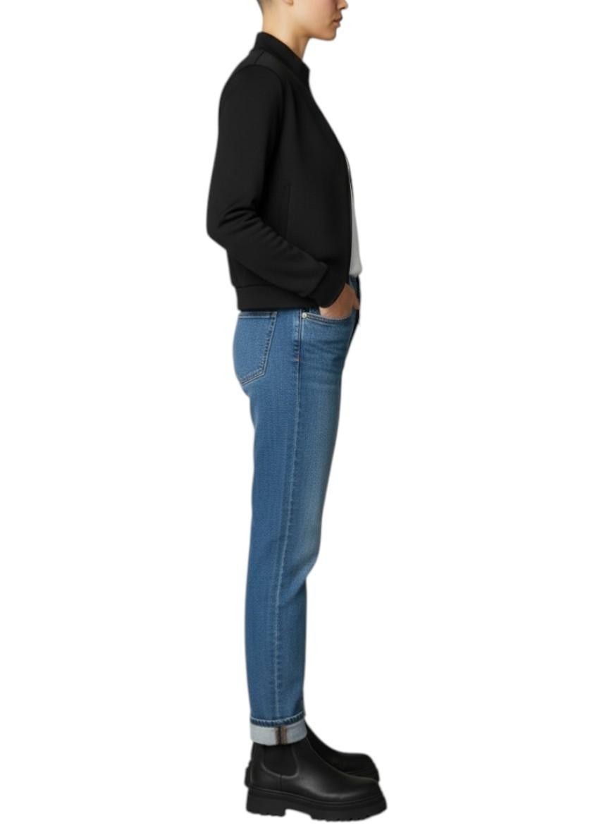 Naked Pear T by Alexander Wang black neoprene bomber jacket worn by a model with blue jeans and black boots
