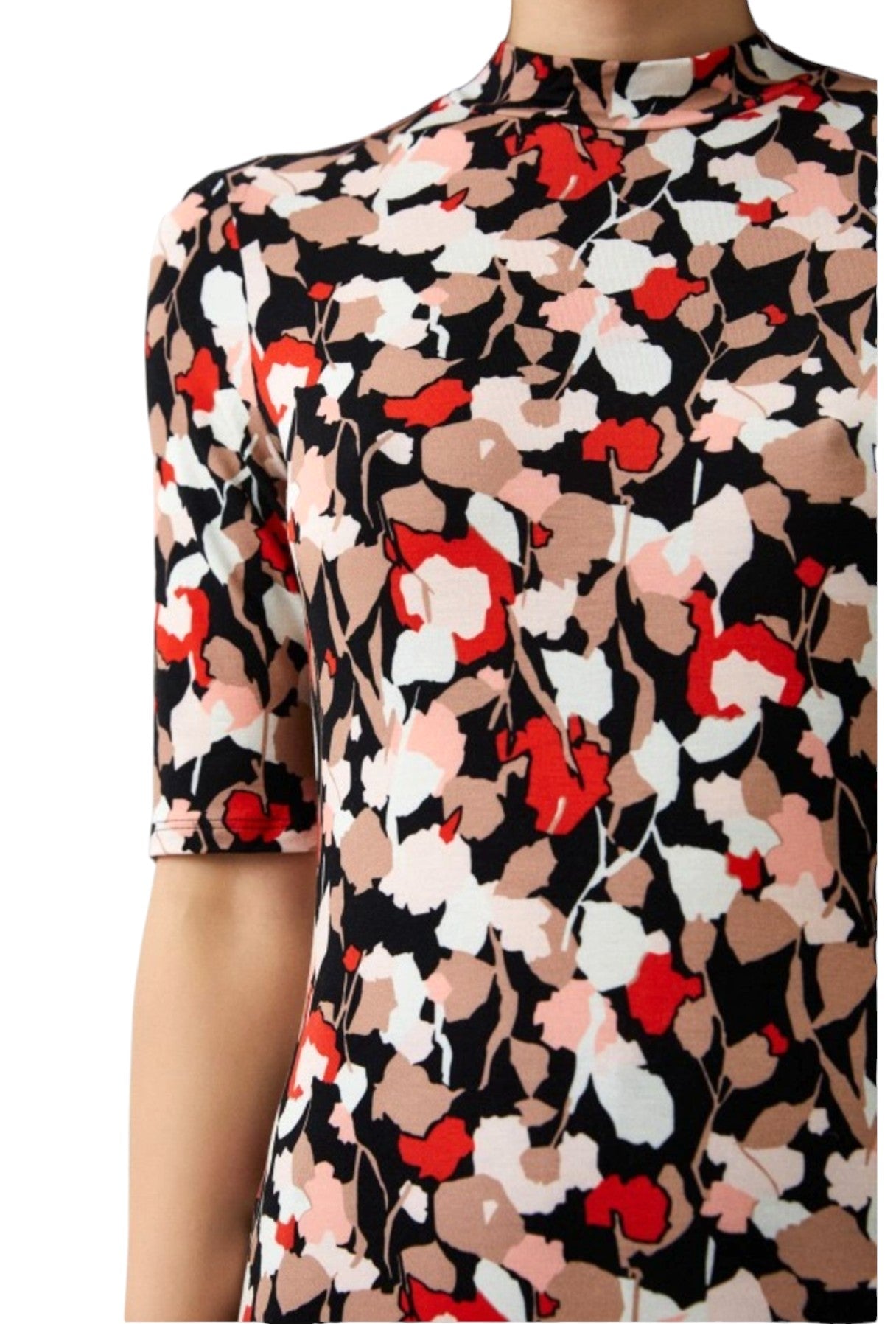 Floral patterned top with red, white, and black colors on a plain background