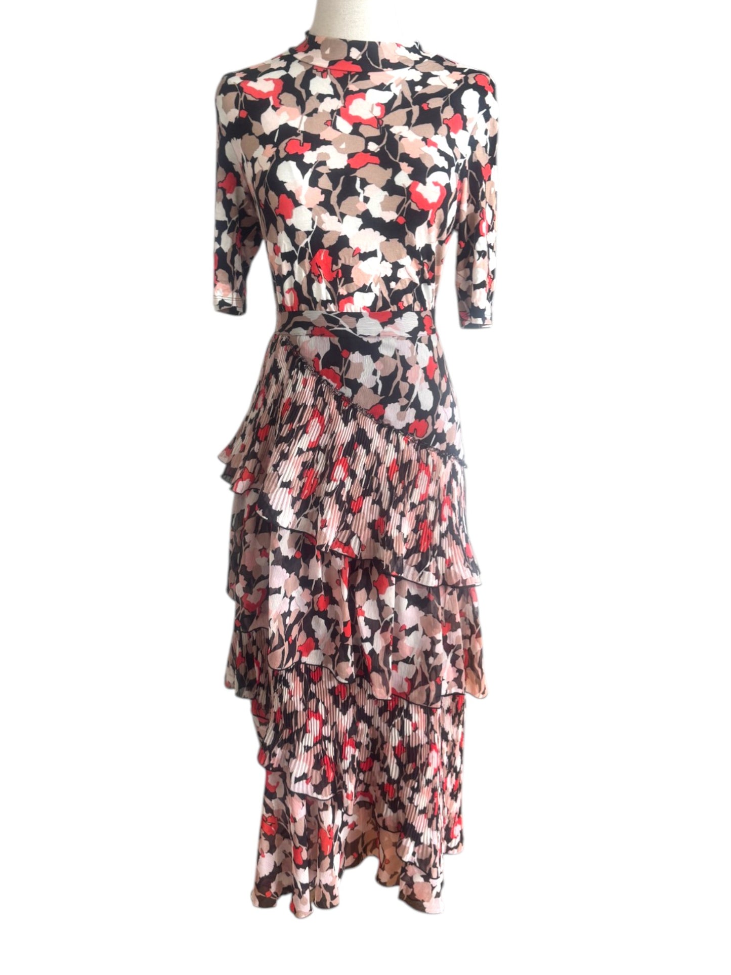 Floral patterned dress on a mannequin against a white background