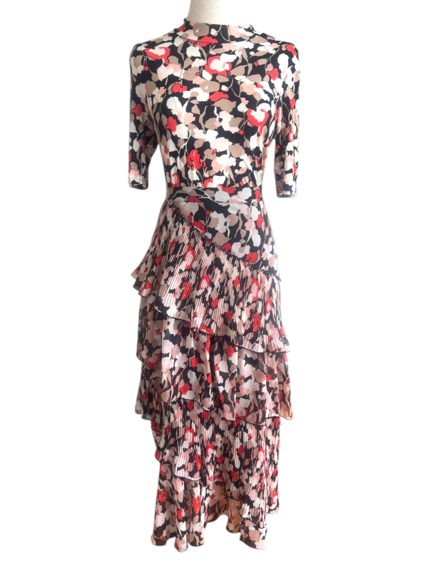 Floral patterned dress on a mannequin against a white background