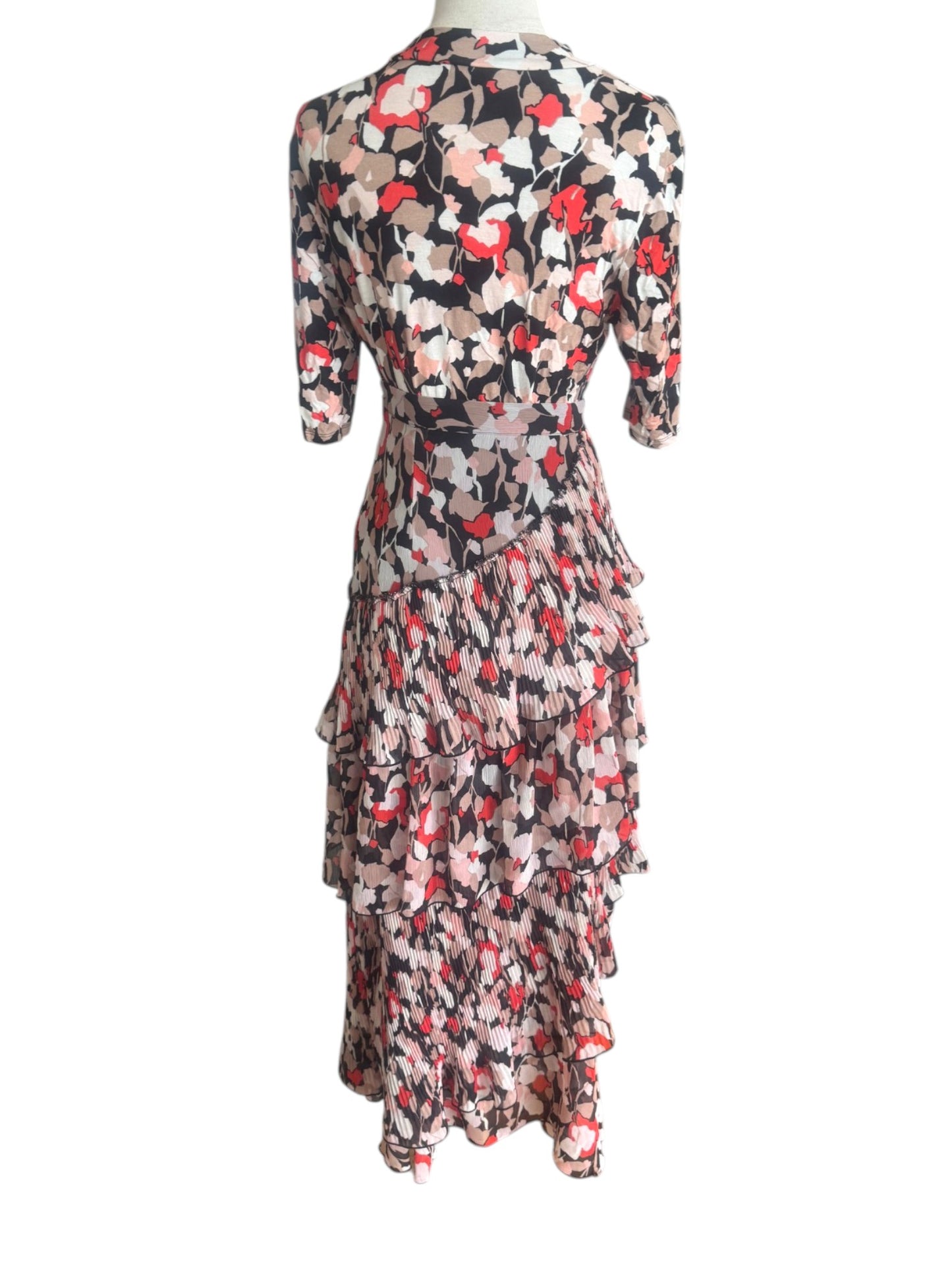 Floral dress on a mannequin against a white background