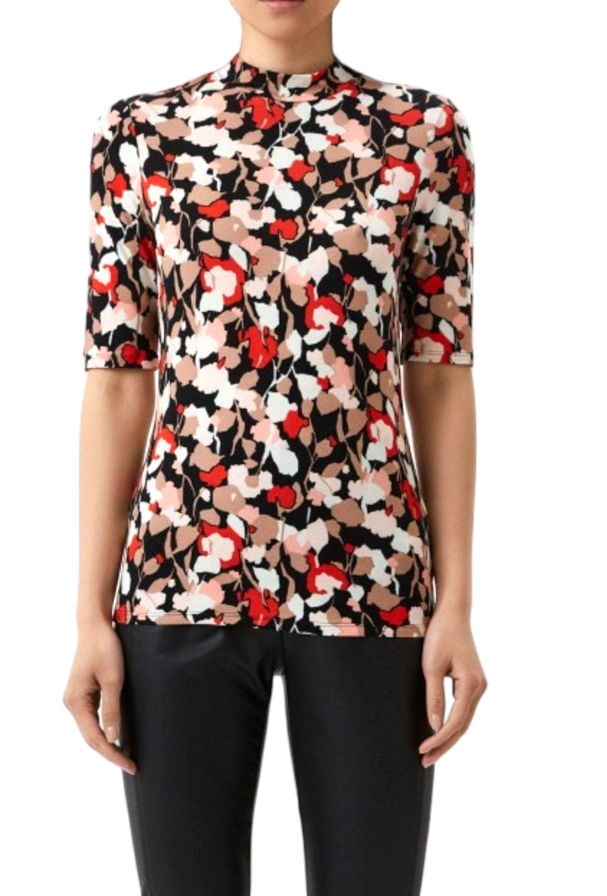 Floral patterned blouse worn by a person on a white background