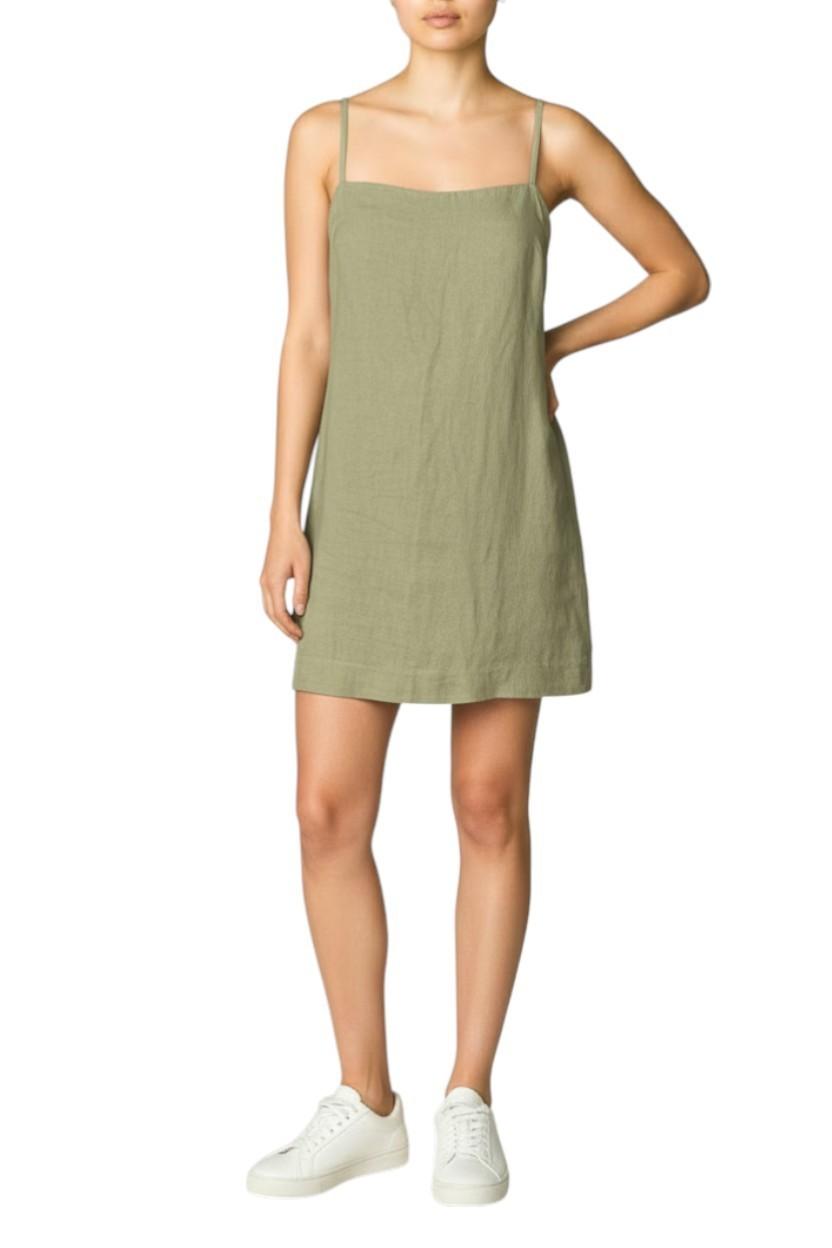 AI generated image of Person wearing a green dress on a white background
