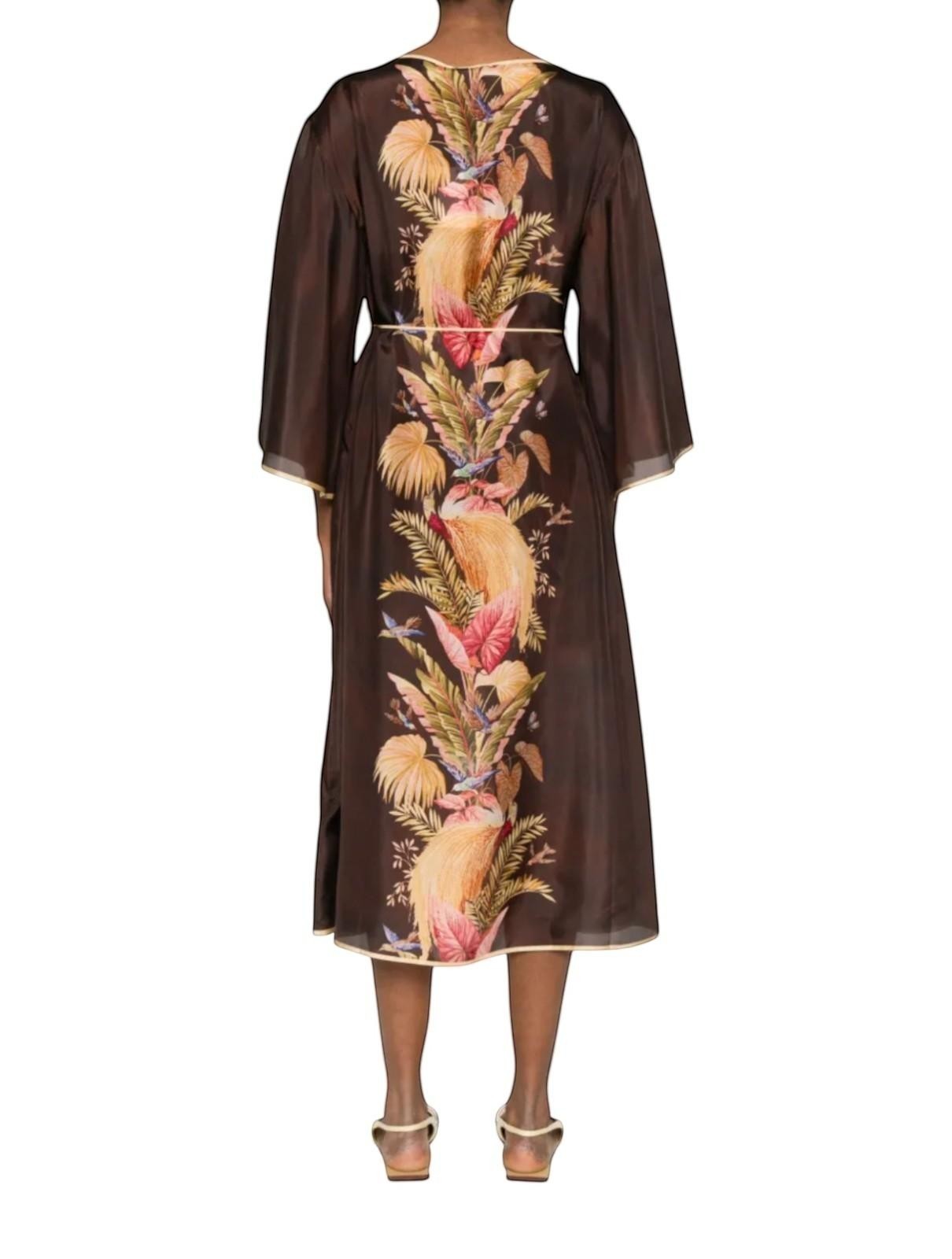 Back view of Naked Pear Zimmermann silk midi tunic dress in burgundy palm floral print with wide sleeves and belt