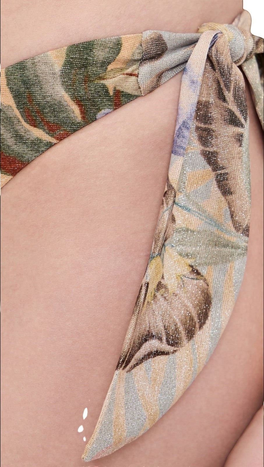 Naked Pear Zimmermann Coco low-rise bikini bottoms in tan multi floral print with adjustable side tie closures.