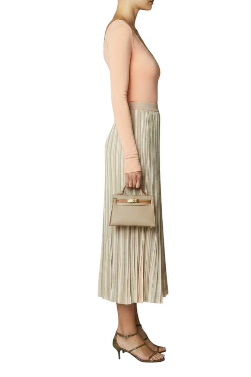 Naked Pear Zimmermann Illuminate Moulin pleated midi skirt in pastel multi-stripe knit fabric worn by a model