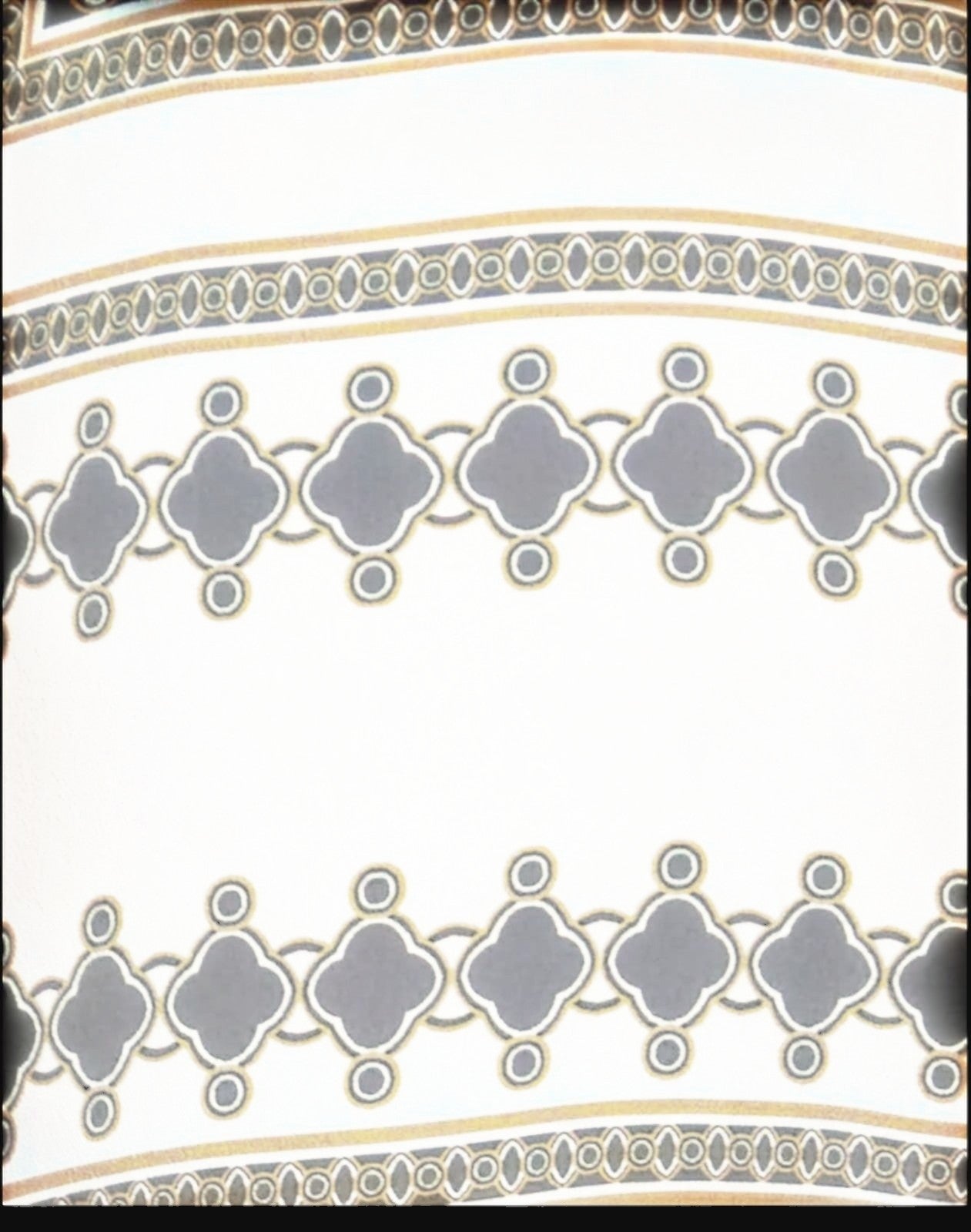 Naked Pear Zimmermann silk flare pants featuring a black, cream, and brown geometric print pattern.