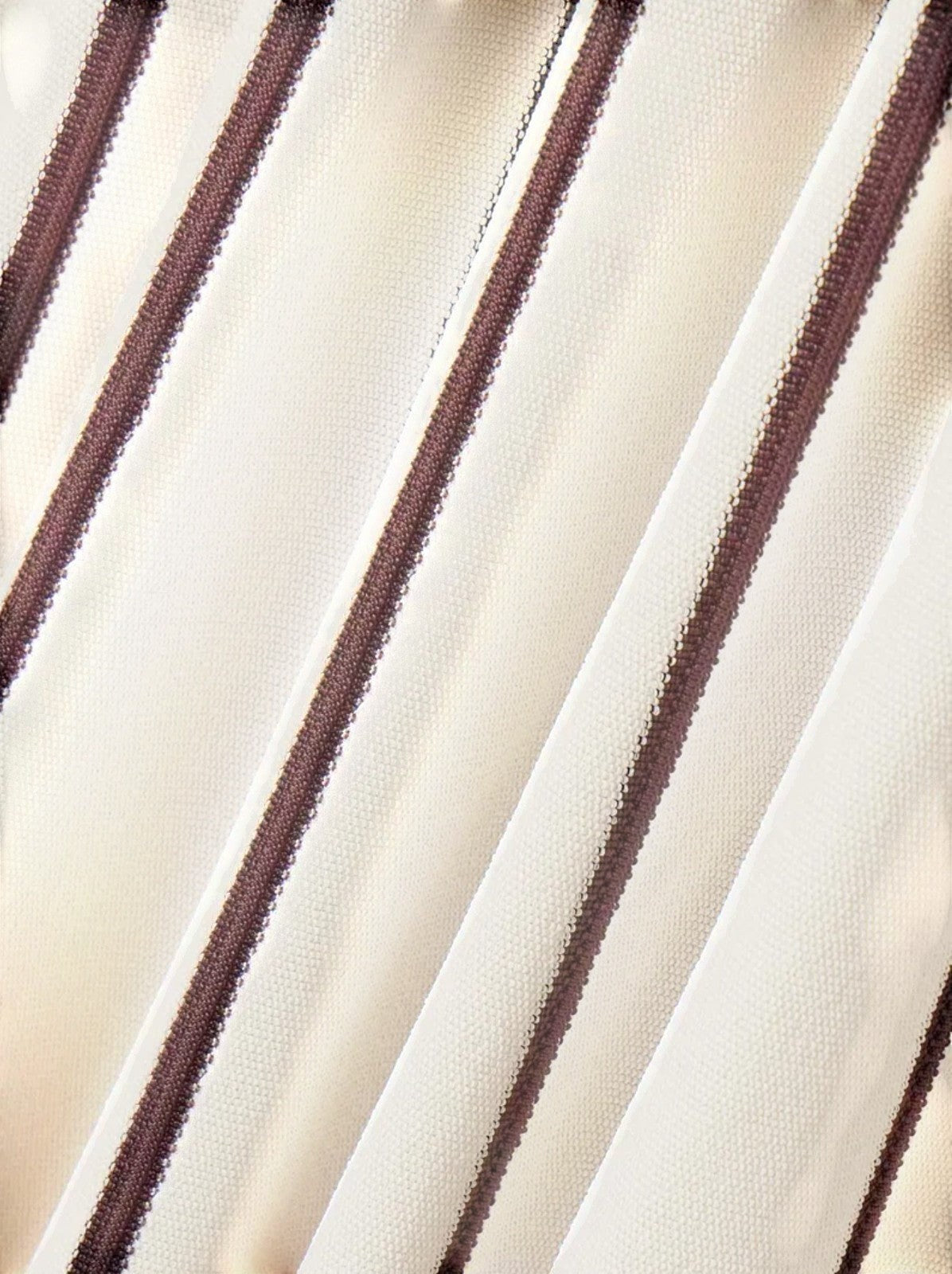 Naked Pear Zimmermann Illuminate midi skirt featuring a black and white diagonal striped knit fabric texture