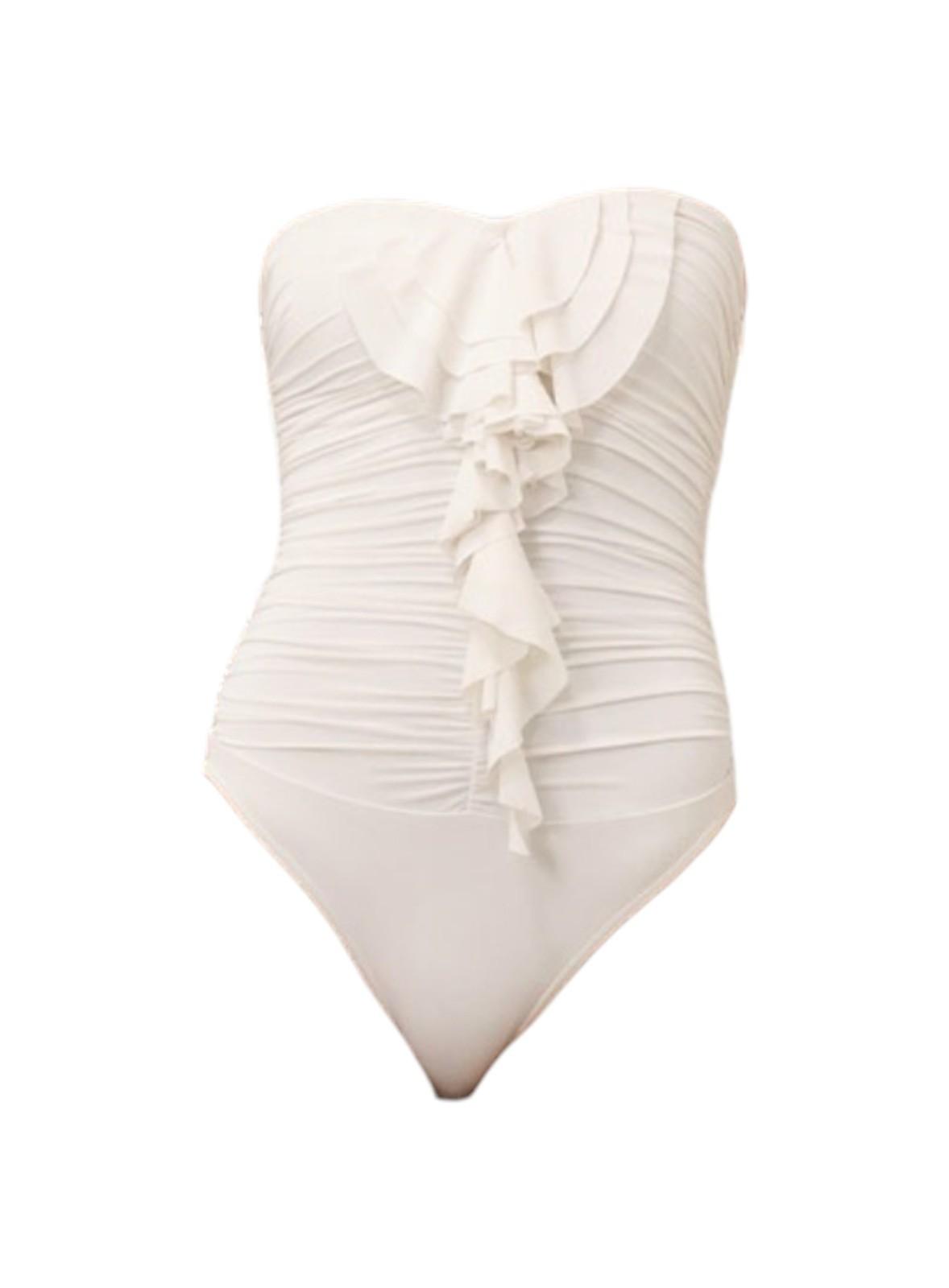 White strapless swimsuit with ruched design and bow detail on a white background