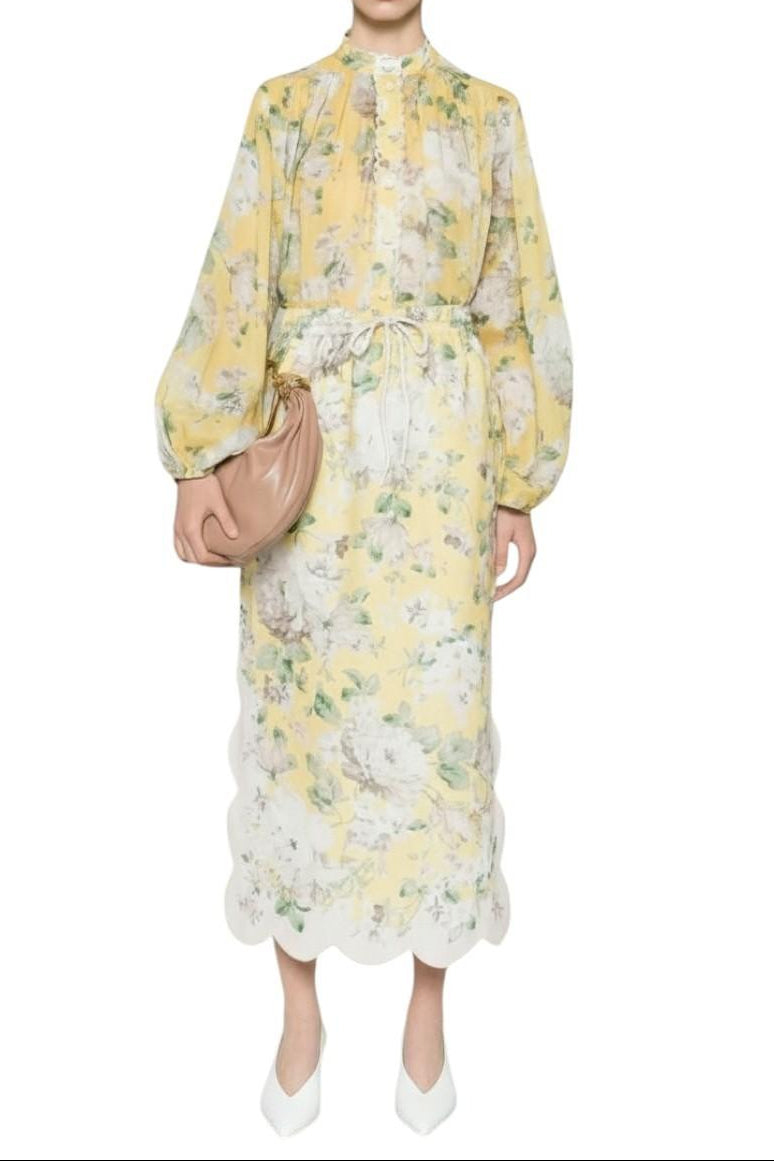 AI generated image of Woman wearing a yellow floral dress holding a beige handbag on a white background