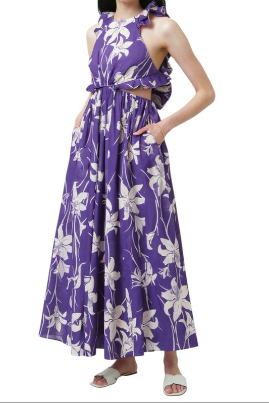 Woman wearing a purple floral dress on a white background