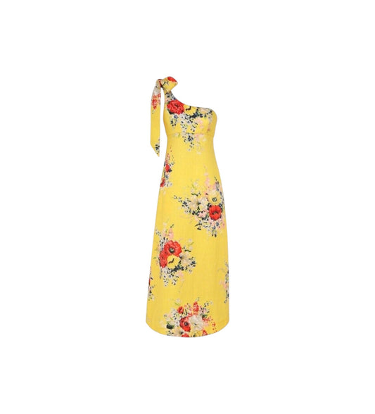 A yellow one-shoulder midi dress with a red and multicolor floral print, featuring a tie-neck detail, shown against a plain white background.