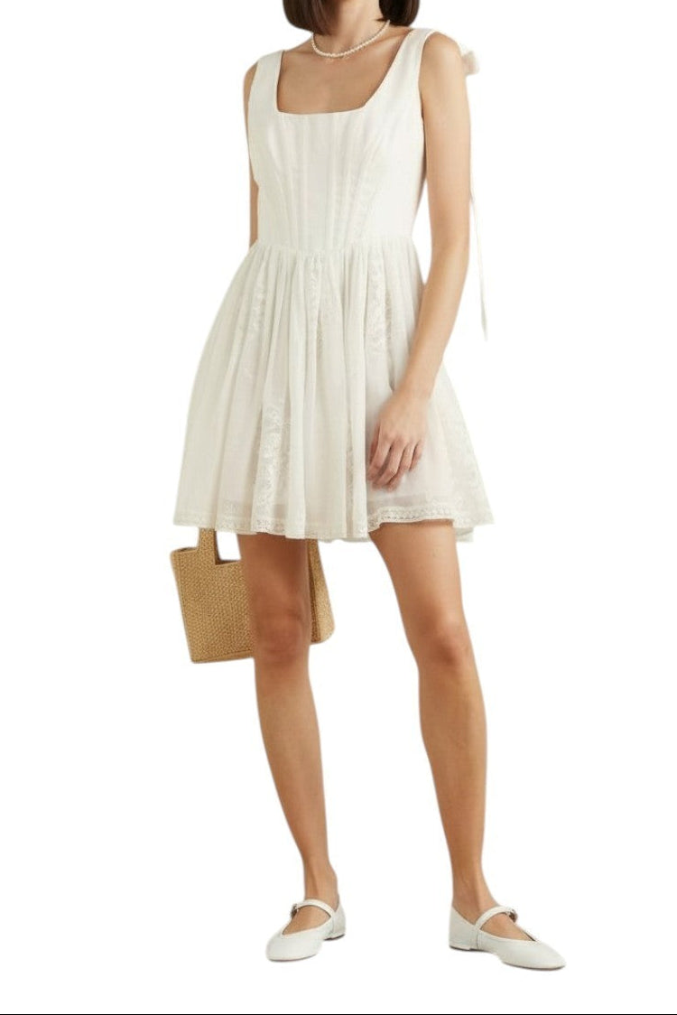 AI generated image of Woman wearing a white dress holding a beige bag on a white background