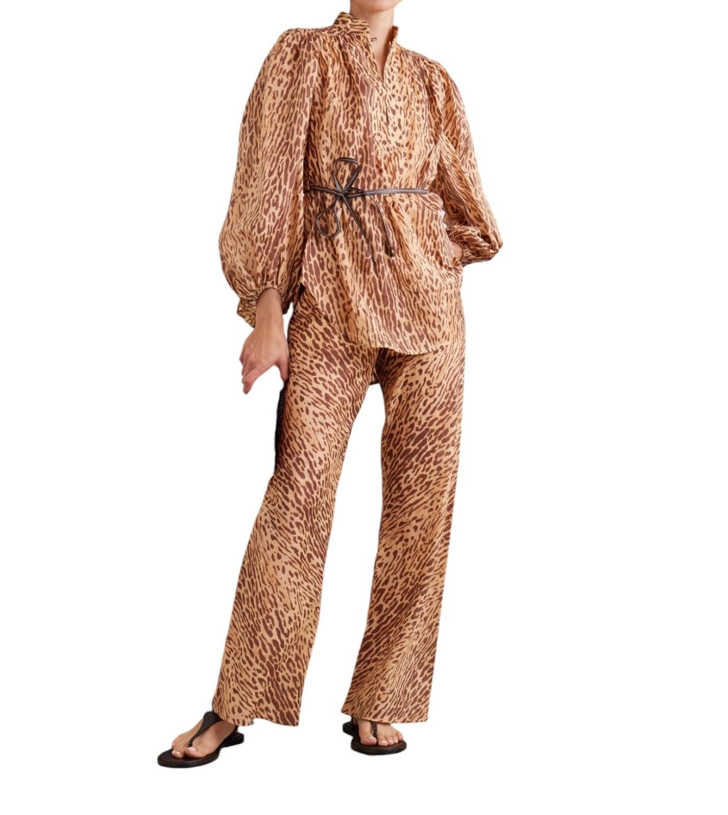 Leopard print outfit with a top and pants on a white background