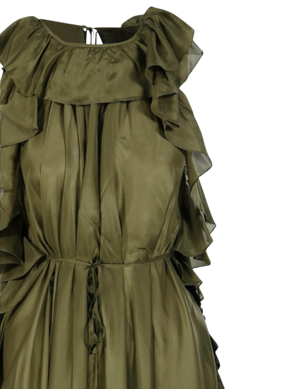 Green dress with ruffled details on a white background