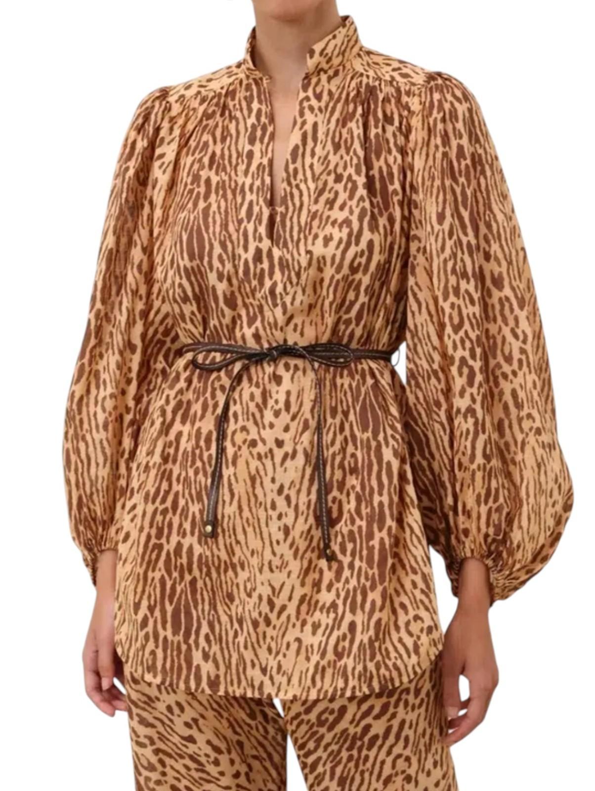 Leopard print long-sleeve top worn by a person on a white background