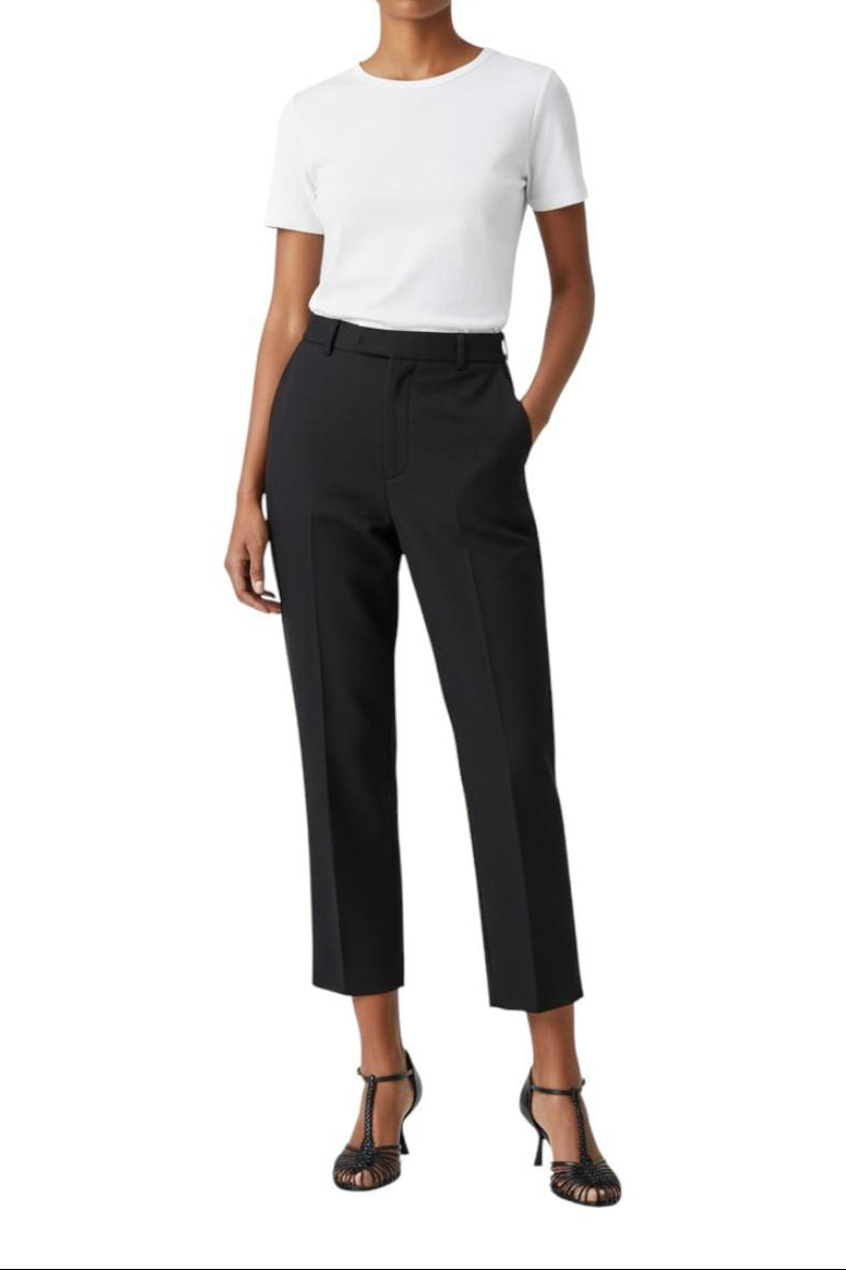 AI-generated image of Person wearing a white top and black pants and black shoes on a white background