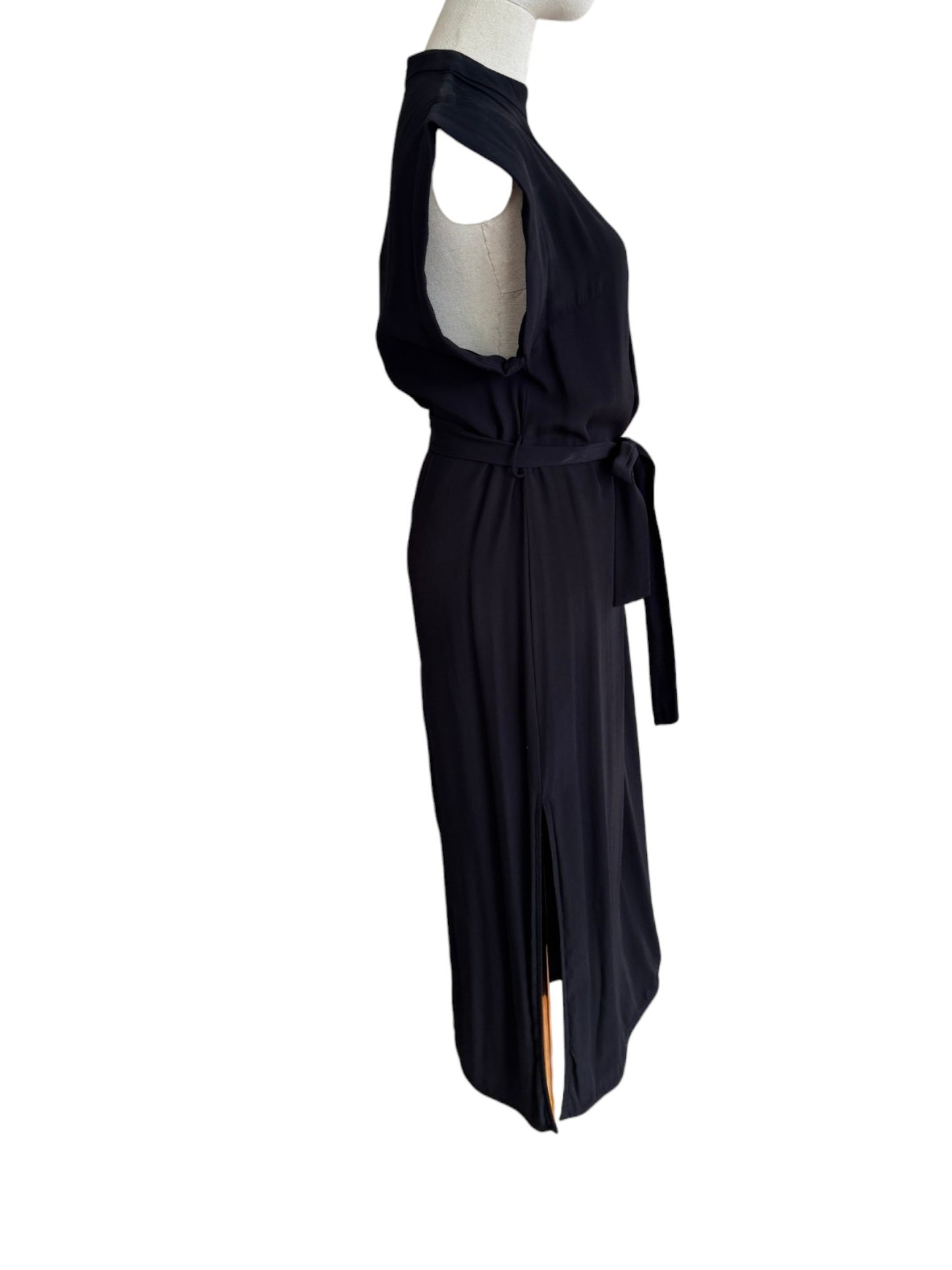 Black sleeveless dress with cut-out shoulders on a white background