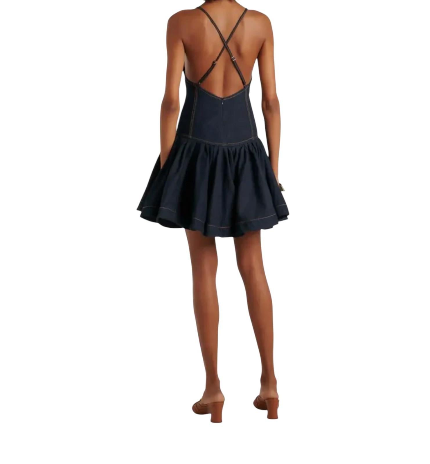 Black dress with criss-cross straps on a white background