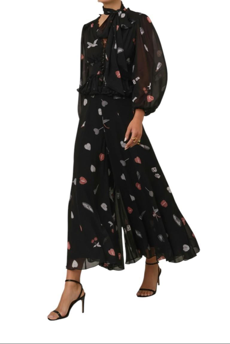    AI-generated image of Black outfit with floral pattern on a white background