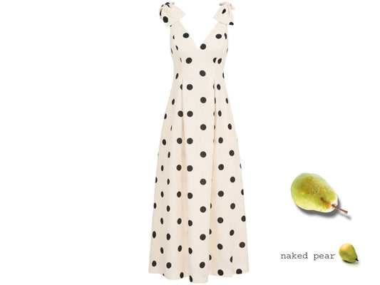 White dress with black polka dots on a white background with a pear graphic.