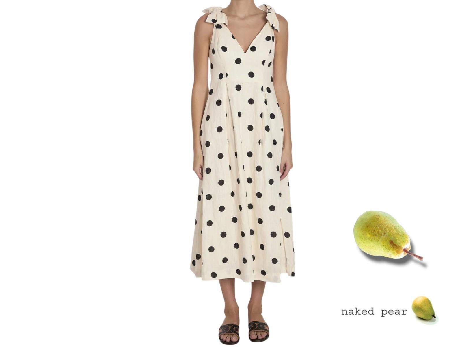 Woman wearing a polka dot dress with a naked pear graphic on a white background
